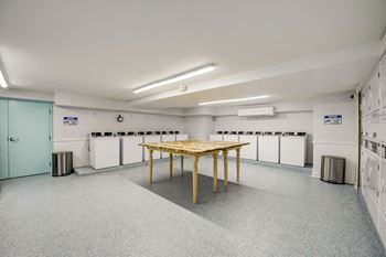 Large, climate-controlled clothing care center w/ digital payment & remote monitoring technology.